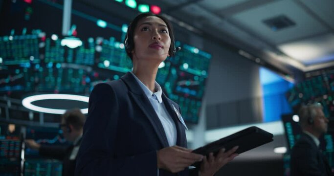 Smart Stock Exchange Agent Having a Conversation on a Phone Call, Suggesting a Client to Invest in a New Successful Startup That Just Went Public Through an IPO. Portrait of a Beautiful Asian Female