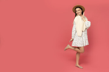 Smiling young woman in a straw hat