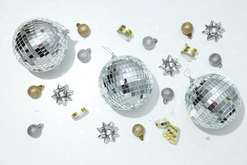 Disco balls with decorations on a light background
