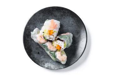 Vietnamese spring rolls with vegetables, rice noodles and prawns isolated on white background. Top view