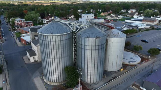 Brock grain bins in downtown in USA town. Aerial shot.