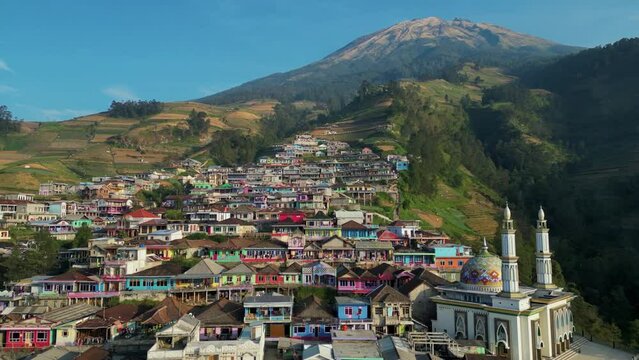 Colourful houses and mosque of Nepal Van Java Indonesian village in Java. Aerial