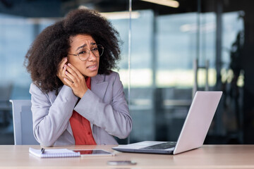 Ear inflammation and pain at workplace, business woman has severe ear pain, holding hands, sick...