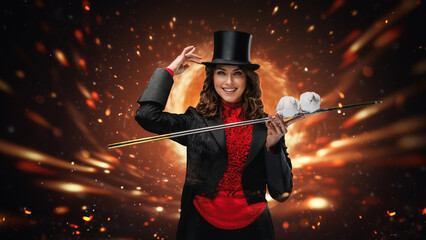Smiling magician tipping hat with doves on wand, fiery backdrop