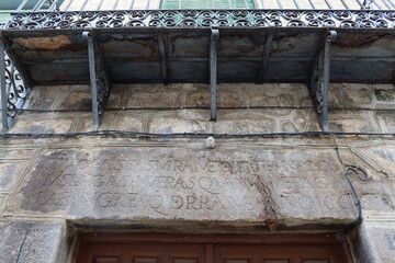 Cebreros, Avila, Spain, November 28, 2023: Stone lintel with Latin words on a house in the town of Cebreros, Avila, Spain
