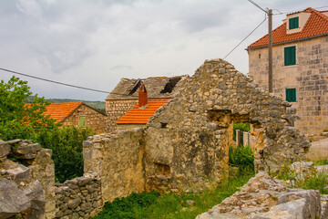 A street of historic derelict stone houses in Loziscz Village in the centre of Brac Island in...