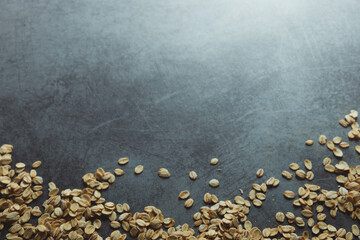 Oatmeal scattered on a gray table