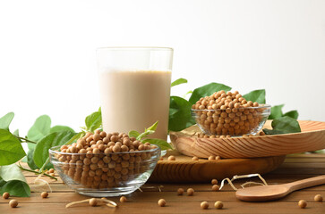 Background with bowls with soy beans and glass with drink