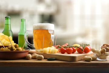 Snacks and beer on wooden bench in a local drinking