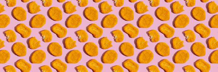 Seamless pattern with chicken nuggets on pink background. Food banner.