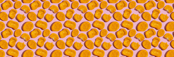 Seamless pattern with chicken nuggets on pink background. Food banner.