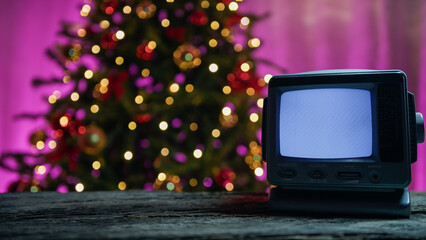 Static Television playing under Christmas tree, copy space