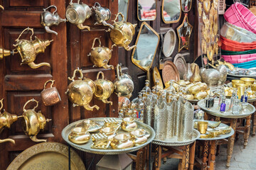 Silver and golden houseware at local market
