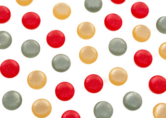 White background with plastic round multi-colored buttons 