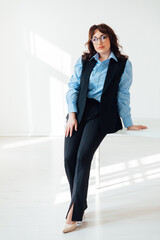 beautiful young woman in a business suit on a white office