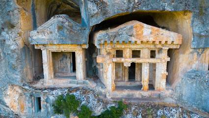 Ancient Lycian rock tombs in Pinara ancient city, Fethiye - Turkiye.	 - obrazy, fototapety, plakaty