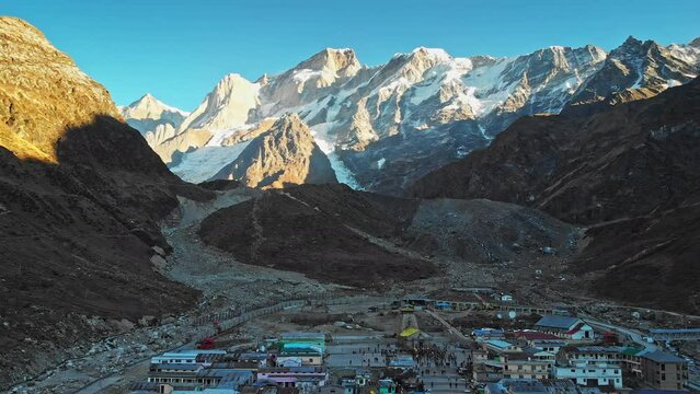 Aerial view of Kedarnath Temple  located on the Garhwal Himalayan Range near the Mandakini River, beautiful Hindu temple surrounded by a huge crowd of devotee