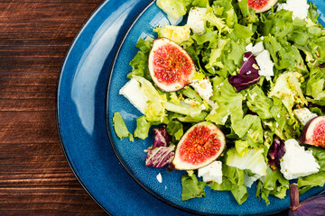 Dietary salad with figs, herbs and cheese.