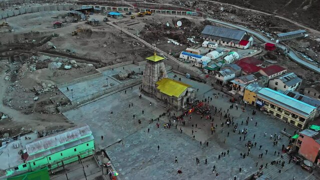 Aerial view of Kedarnath Temple  located on the Garhwal Himalayan Range near the Mandakini River, beautiful Hindu temple surrounded by a huge crowd of devotee