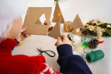Step-by-step instructions on how to make a Christmas tree out of cardboard. Step 1 Cut out the...
