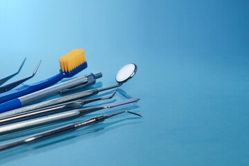 Сollection of dental tools isolated on blue background