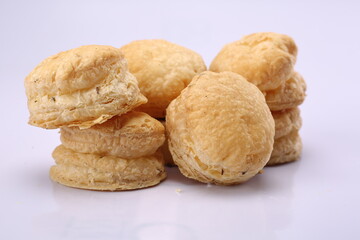 Macron shaped salted khari on isolated white background. Indian Salty Snack. High Resolution