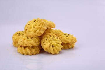 Peanut butter cookies stack on white board. High Resolution