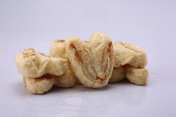 Fan Puff Traditional Indian Namkeen Snack. Seamless white Color Background. High Resolution