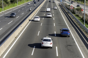 Image of the lanes of an access road to the city of Madrid, Spain with traffic in both directions
