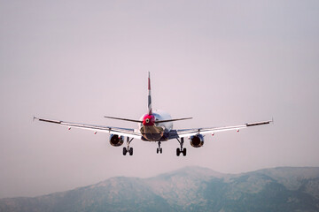 Rear of a plane about to land at an airport