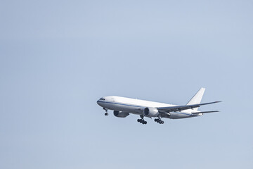 An airplane cargo jet descending altitude to land at an airport