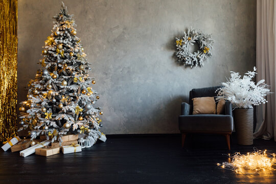 Snowy christmas tree with gifts interior new year
