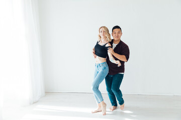 Man and woman dancing to bachata music