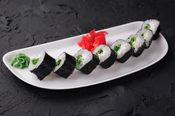 Maki Sushi with Spring Onion inside on plate