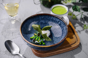creamy spinach soup with peas top view