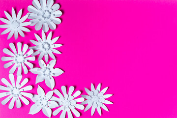 White flowers made of paper on a pink background. Handmade, Paper craft.