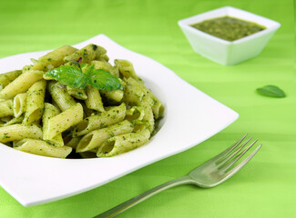 penne pasta with pesto and basil