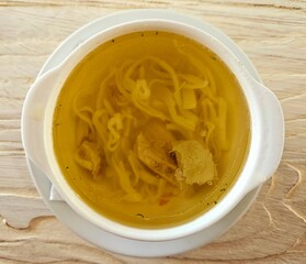 Broth - chicken soup with noodles in a bowl