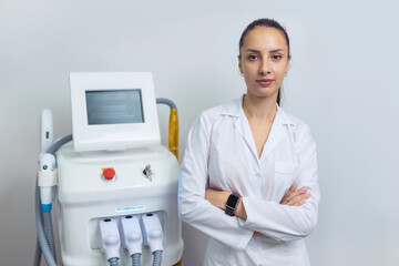 Doctor specialist beautician stands near the laser hair removal device