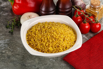 Dry wheat bulgur cereal heap