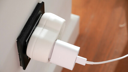 The fast charger socket of the mobile phone is plugged in.