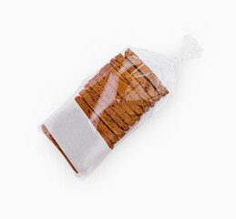 close up of white sliced toast bread in transparent packaging