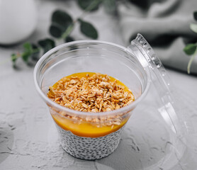 Chia pudding with mango and granola top view