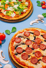 Fresh tasty pizzas on top view