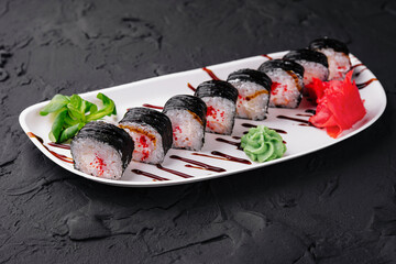 sushi maki rolls with tobiko caviar inside