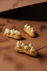 eclairs with whipped cream and hazelnuts