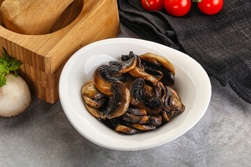 Roasted champignon mushrooms in the bowl
