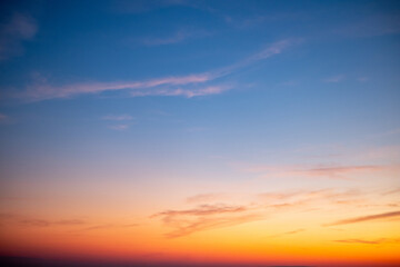 Beautiful of luxury soft gradient orange gold clouds and sunlight on the blue sky perfect for the background, take in everning,Twilight