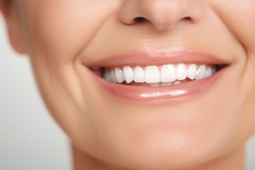 Obraz premium Smile of beautiful middle aged mature woman with perfect white teeth close-up. Dental care concept, professional cleaning, whitening. Dentistry, beautiful smile