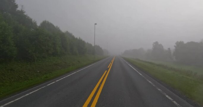 Fog on a Norway road. POV car trip. Vehicle point-of-view Driving a Car on a Road in Norway.